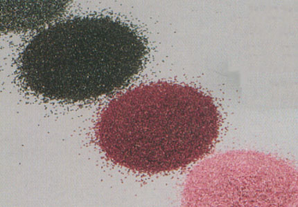 Granulated darkred corundum dust